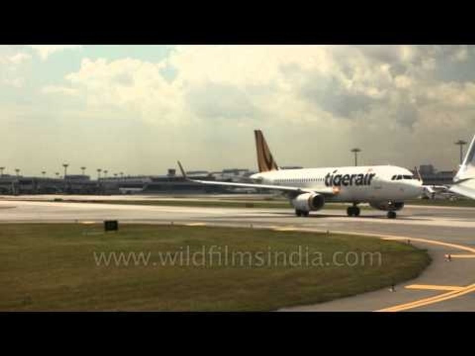 Tigerair jet taxiing on Kuala Lumpur airport runway
