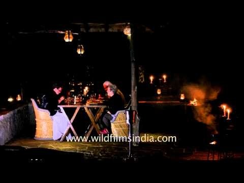 Visitors dining under the open sky at Kanha Earth Lodge