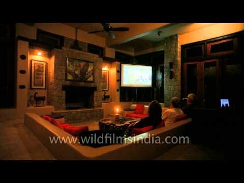 Guest watching movie at Kanha Earth Lodge