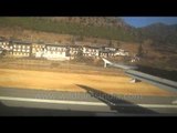 Shadow chases a planes as it lands at Paro airport in Bhutan