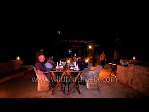 Tourists dining outside at Lodge Terrace in Kanha Earth Lodge