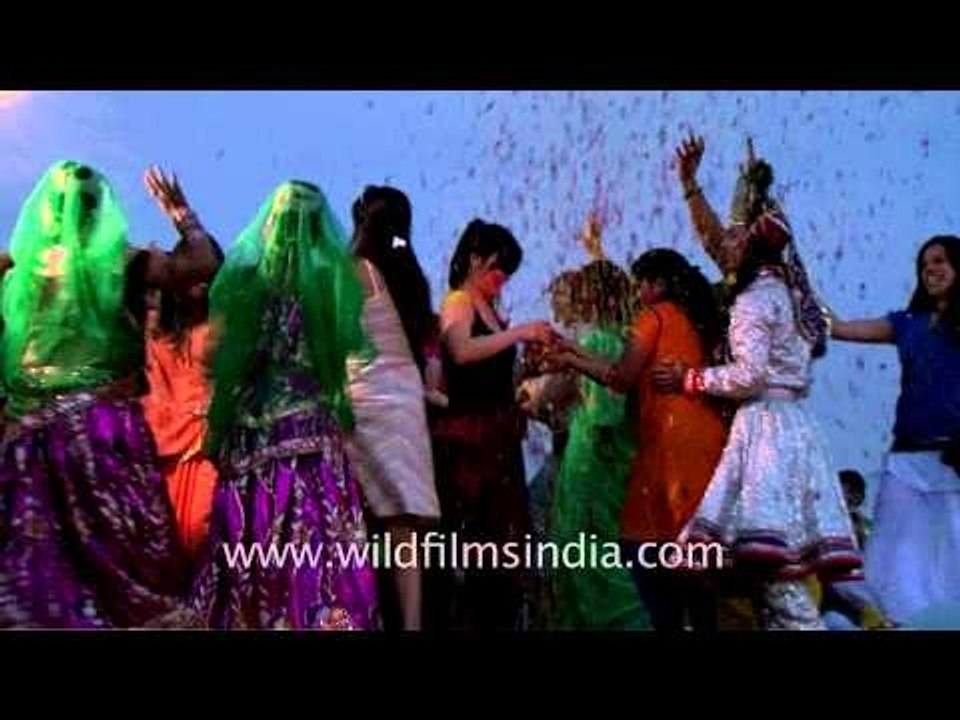 A cloud of flower petals envelopes raasleela dancers