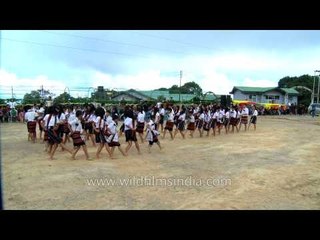 Young Mizo children standing in rows perform Chawnglaizawn