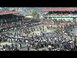 Security personnel control the crowd during Chapchar Kut