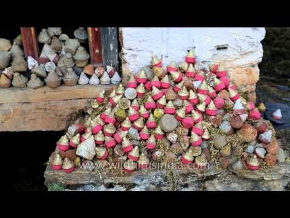 Traditional water-powered prayer wheel in Bhutan with Tsa Tsa cones
