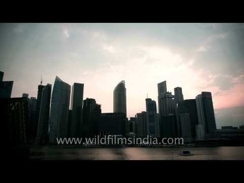 Singapore time lapse of clouds passing ominously over buildings in silhouette