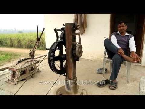 Railway level crossing operator waiting for a train to pass, Uttar Pradesh