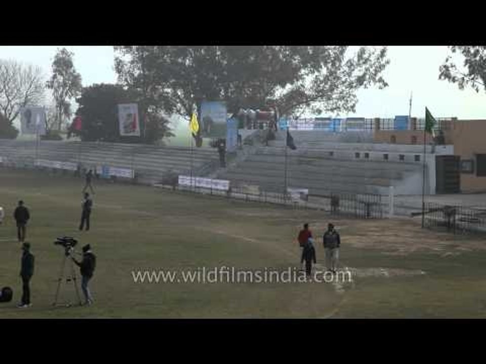 Volunteers setting up goal post for the hockey match: Kila Raipur