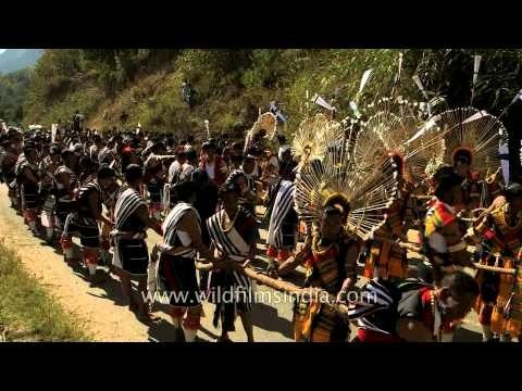Angami folks yodelling and chanting as they pull stone chariot