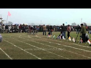 Cyclists competing with one another: Rural Olympics