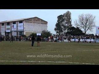Crowd cheering the contestants: Rural Olympics