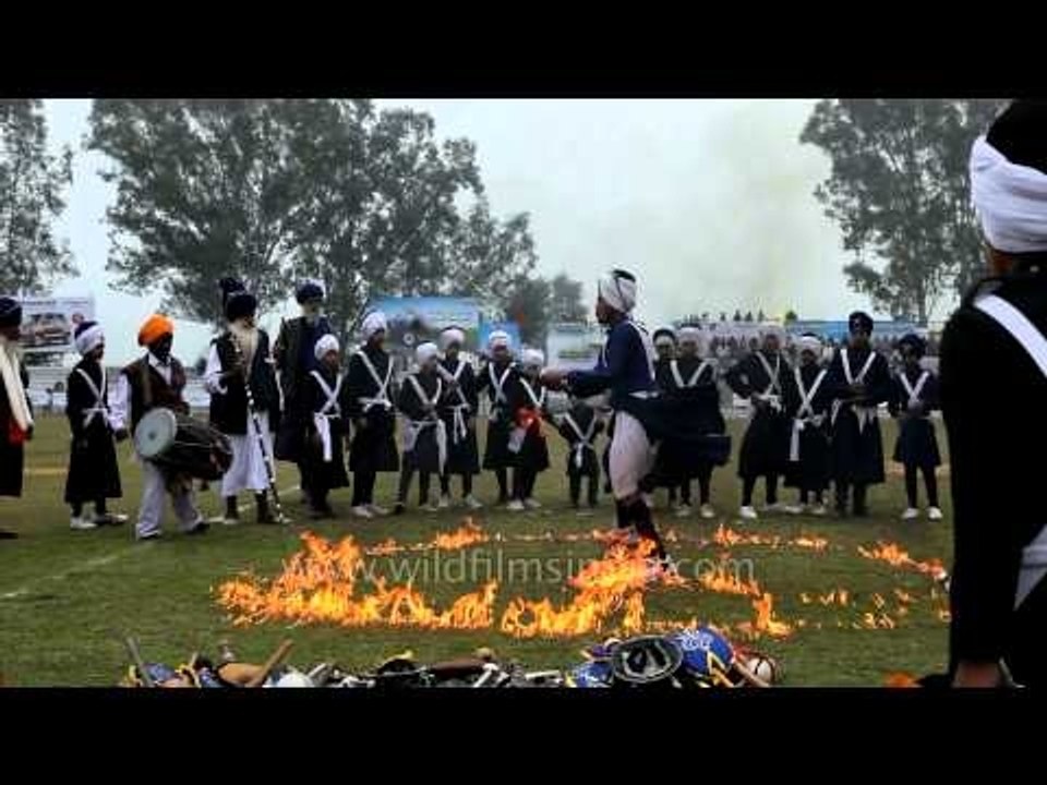 Indian Sikh Nihang performing gatka skills