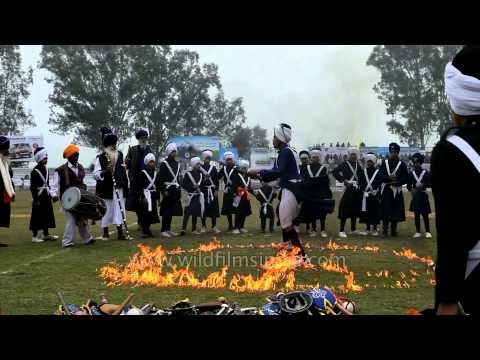 Indian Sikh Nihang performing gatka skills