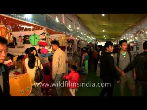 Visitors to the Sangai festival throng the stall area