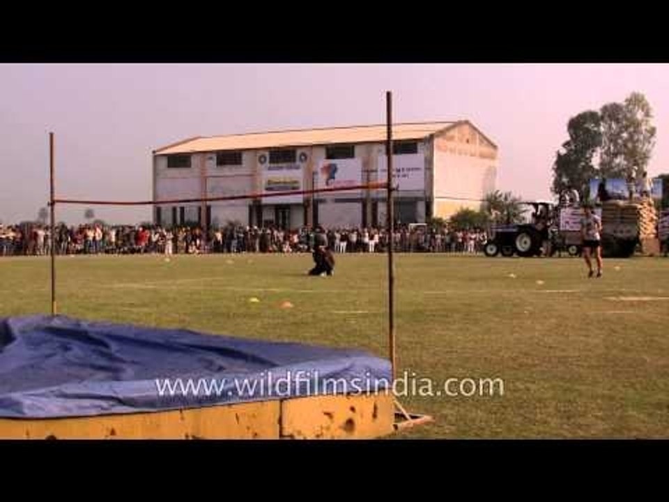 Player warm up before the high jump competition starts