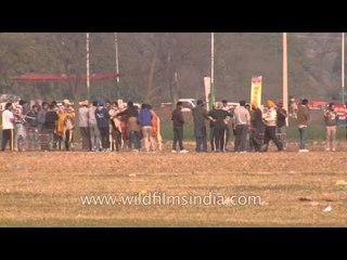 Men ready to race on the ground with their bullock-carts