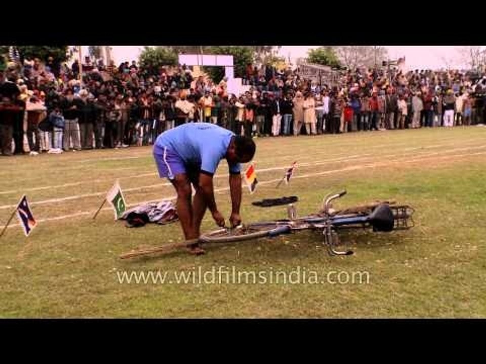 Man preparing the cycle stunt: Kila Raipur Olympic