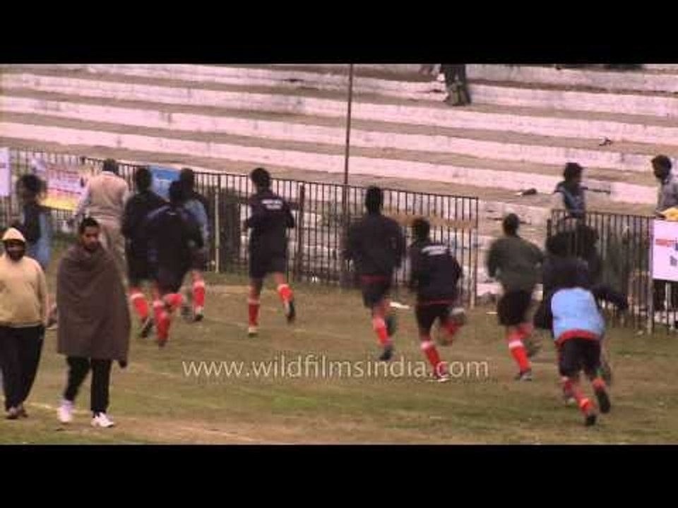 Hockey players warm up during a match at Rural Olympics, Ludhiana