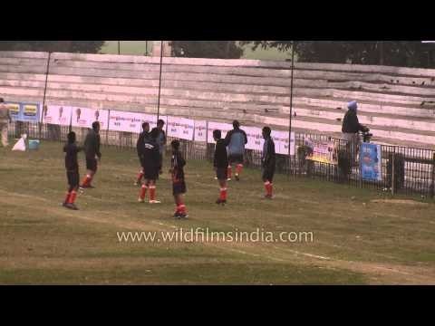 Hockey players warming up before the match : Kila Raipur, Ludhiana