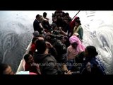 People travelling by steam boat on Loktak Lake