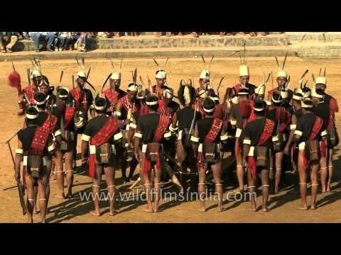 Konyak warriors beating the log drum