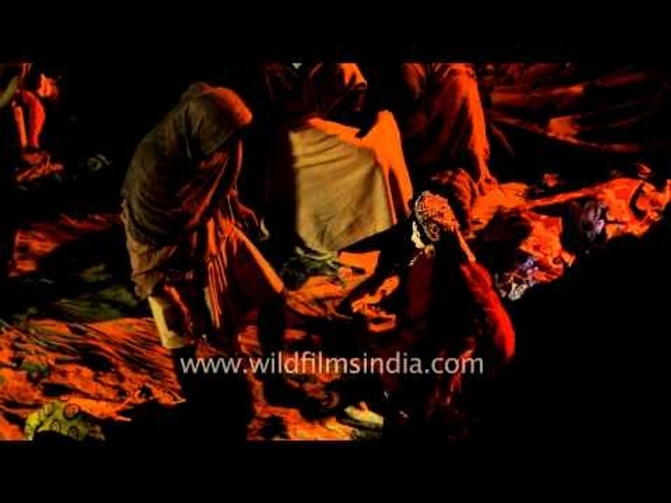 Pilgrims of Gangasagar mela settling down at night