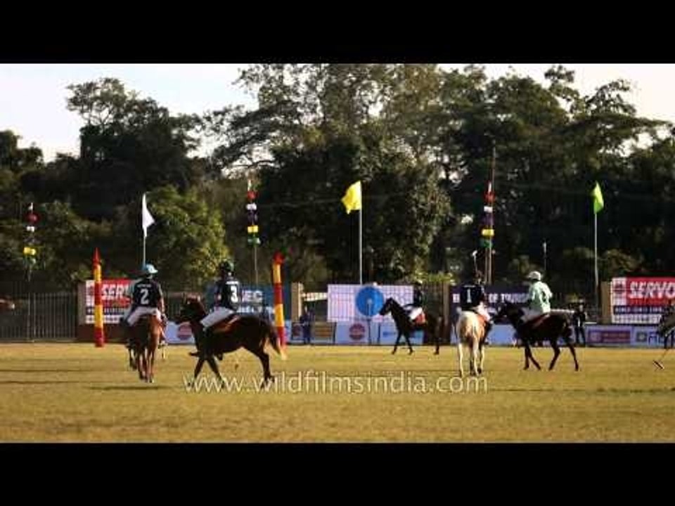 Polo players chasing the ball downfield in a Polo match