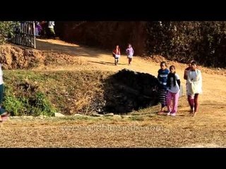 Villagers return from church: Longmai village - Tamenglong, Manipur