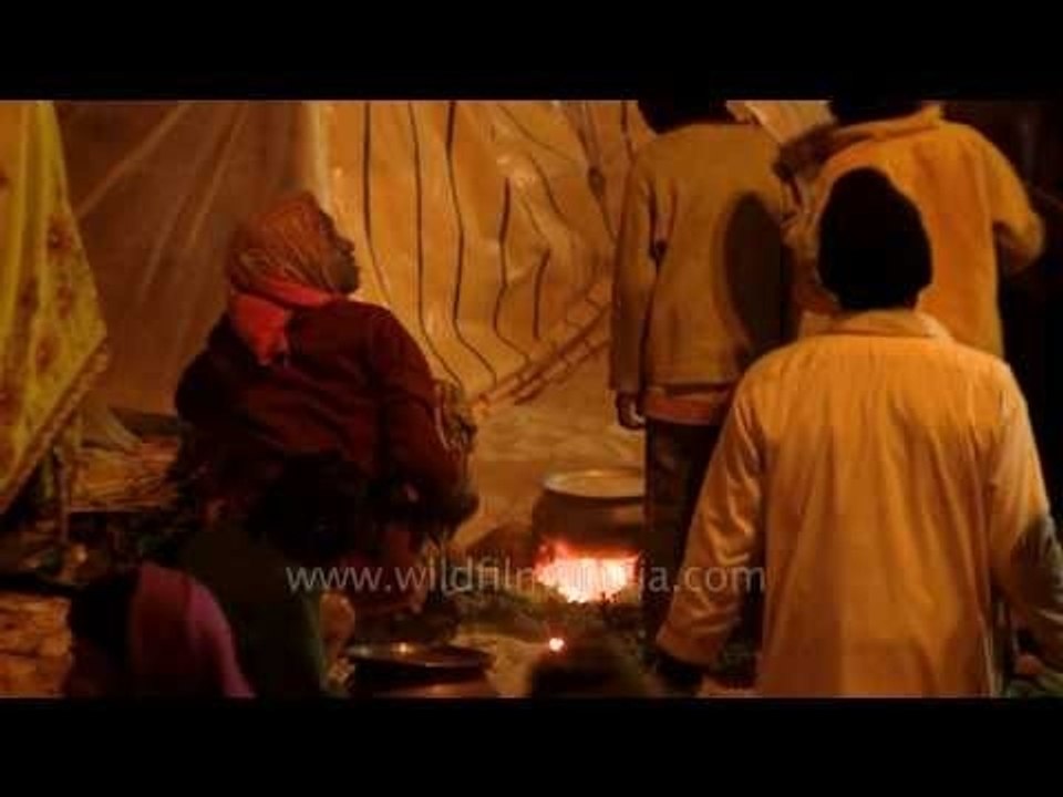 Pilgrims of Gangasagar mela having their meals