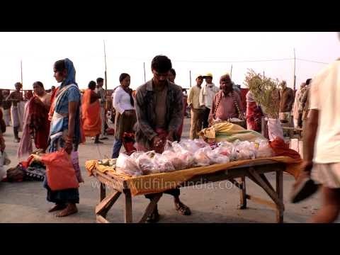 Hindu devotees performing religious rituals during Gangasagar Mela