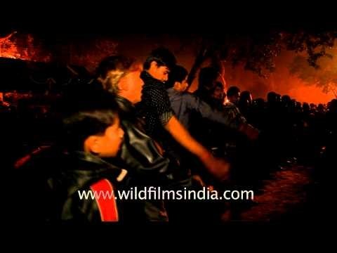 Mourners attending the Chup Tazia, an annual religious procession held by Shia Muslims