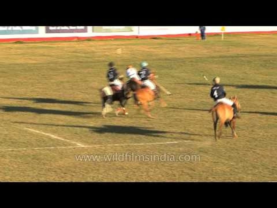 Players disputing the ball in a polo match at Imphal