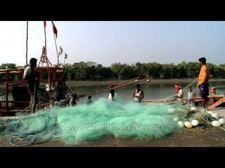 Fishermen with their nets at Frazerganj fishing harbour