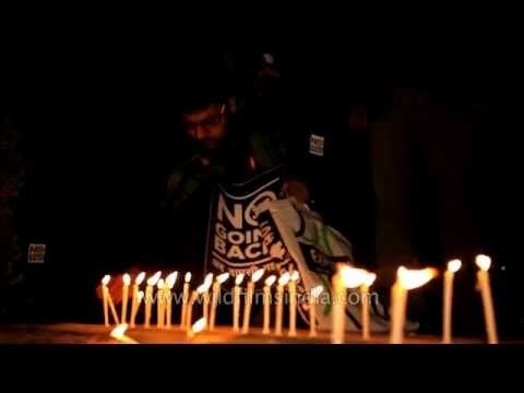 Indian gay rights supporters light candles to show respect