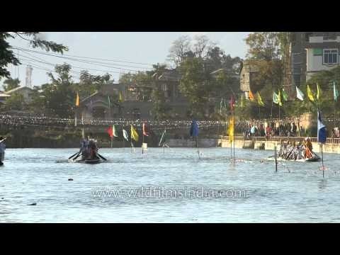 Participants in action at traditional boat race, Imphal