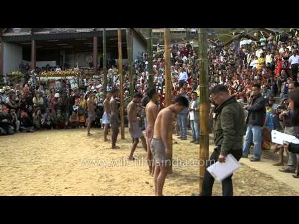 Getting ready for greased pole climbing, Nagaland