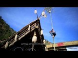 Naga boy tries his hands at greased pole climbing