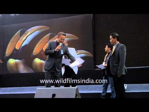 Winner receives prize at King Chilli eating competition