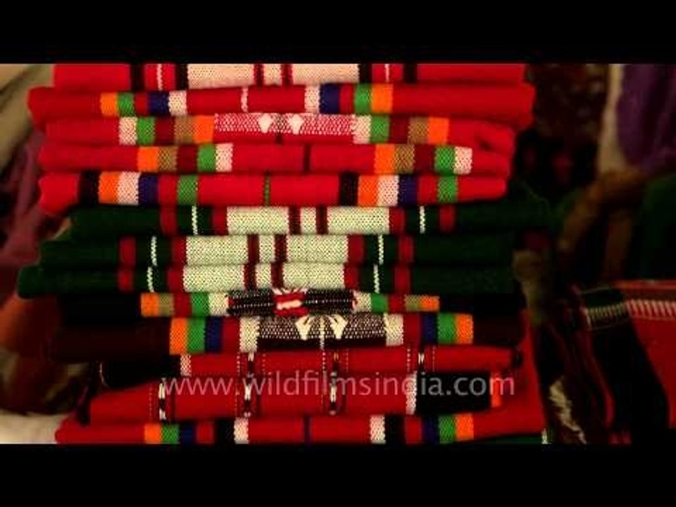 Old women selling Manipuri hand woven shawls and phaneks at Ima market, Imphal