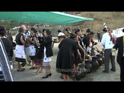 Enjoying locally made rice beer at Nagaland Hornbill Festival
