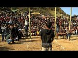 Setting up the bamboo bar high for meat kicking competition in Nagaland