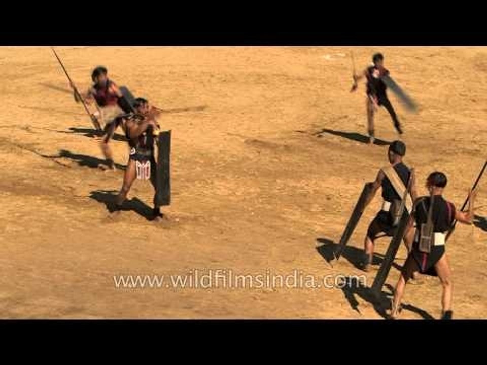 Yimchunger Naga presenting a war enactment at Hornbill Fest