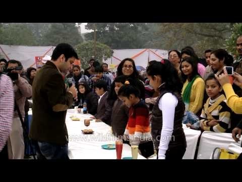 Chef Kunal Kapoor tasting the foods made by children