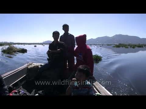 People on a motor boat in Loktak Lake of Manipur