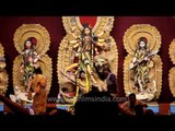 Theme-based puja pandals with floral decorations to welcome Durga Mata
