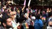 LGBT supporters holds rainbow-coloured banners and flags
