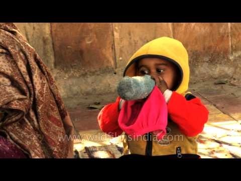 Abject poverty for this mother and child on India's urban streets