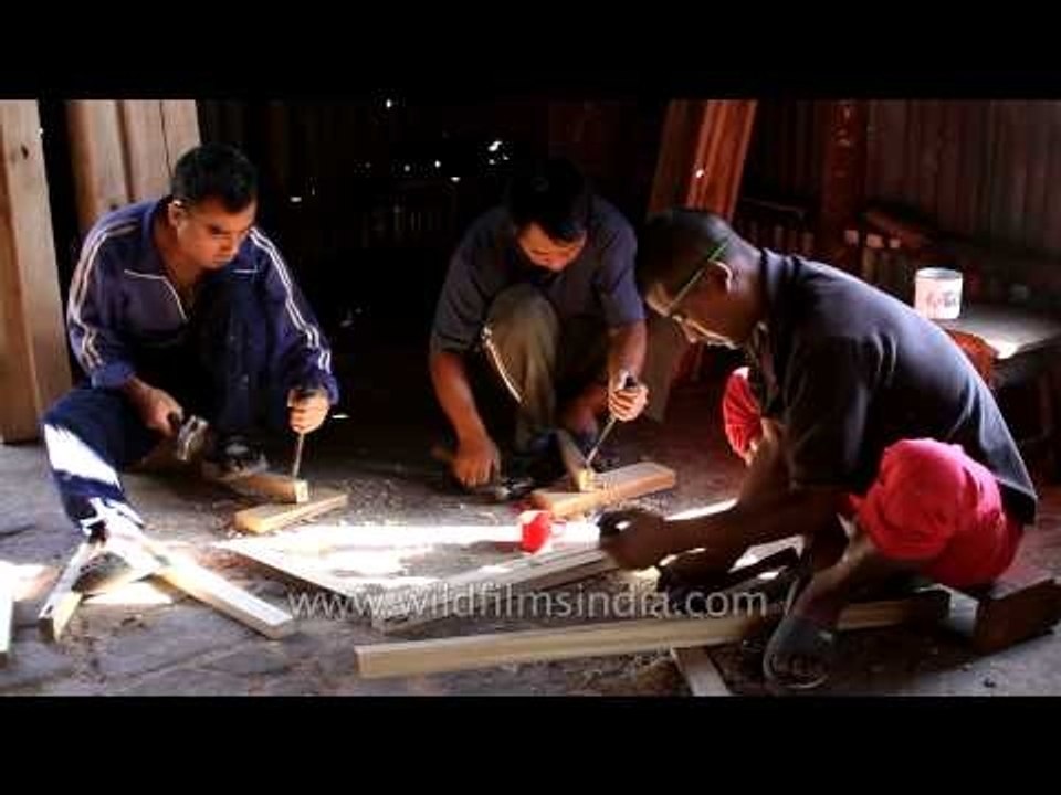 Men working at carpentry worshop