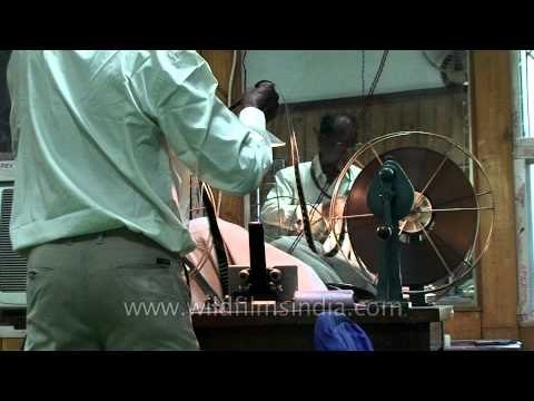 Rolling 35 mm filmstock into spools, for archiving: good old days!