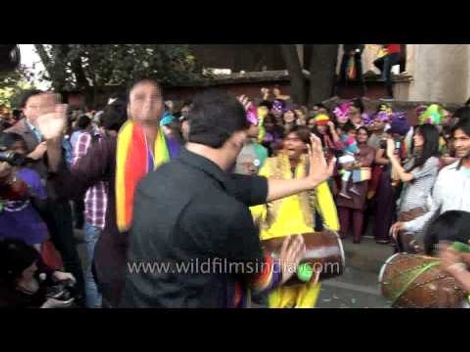 LGBT supporters dancing to the beats of traditi...